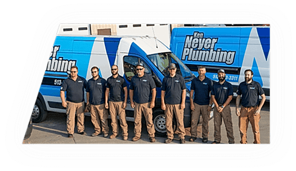 The Ken Neyer Plumbing Team standing in front of their trucks.