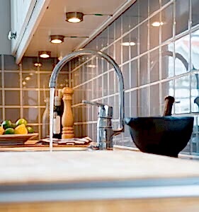 kitchen-faucet-turned-on